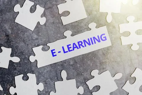 Handwriting text E learning. Internet Concept training through electronic media Stock Photos