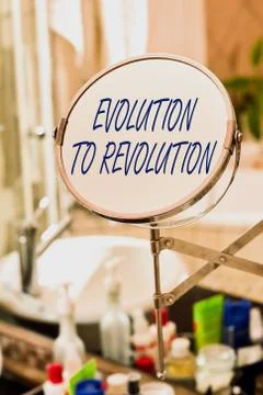 Handwriting text Evolution To Revolution. Concept meaning adapting to way of Fotos de archivo