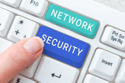Handwriting text Network Security. Business concept practice of securing a Stock Photos