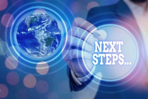 Handwriting text Next Steps. Concept meaning something you do or plan after you Stock Photos