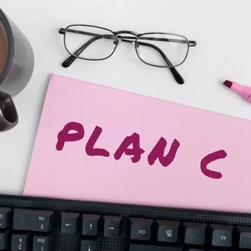 Handwriting text Plan C. Word Written on ones last Backup strategy detailed Stock Photos