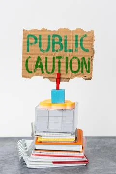 Handwriting text Public Caution. Conceptual photo formal warning given to the Stock Photos