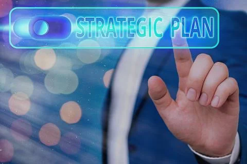 Handwriting text Strategic Plan. Concept meaning a systematic process of Stock Photos