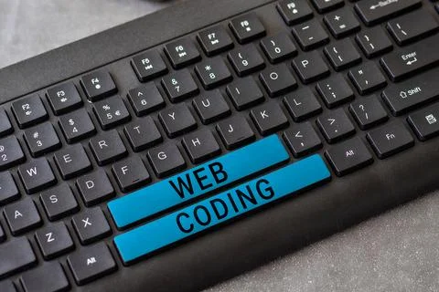Handwriting text Web Coding. Word for work involved in developing a web site for Stock Photos
