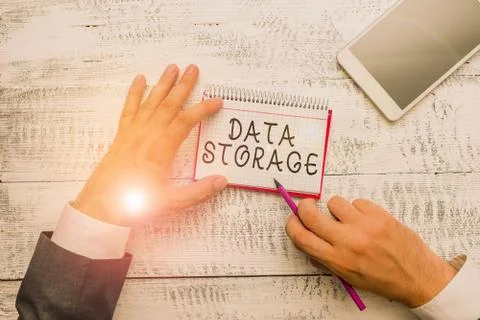 Handwriting text writing Data Storage. Concept meaning the act of archiving data Foto stock