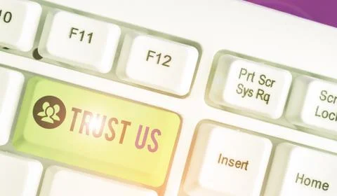 Handwriting text writing Trust Us. Concept meaning to believe that someone is Stock Photos