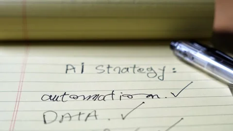 Handwritten AI Strategy Notes On Yellow Notepad Stock Footage 337661923
