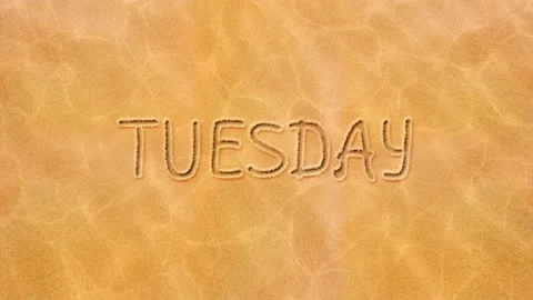 Handwritten animated live text on the sand-Tuesday. Stock Footage 130656057