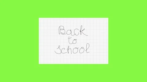 Handwritten back to school message on a sheet of squared paper Stock Footage 312735281
