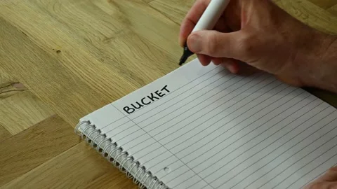 A handwritten bucket list being started Stock Footage 229249010