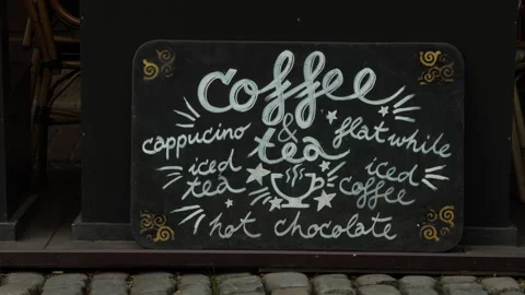 Handwritten cafe chalkboard menu with coffee, cappuccino, iced tea, flat white Stock Footage 337734828