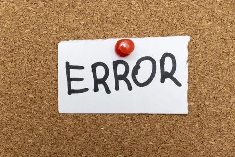Handwritten ERROR on white paper pinned to cork board, suggesting flaws or Stock Photos
