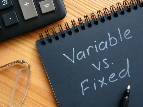 Handwritten inscription variable vs fixed by marker. Fotos de archivo