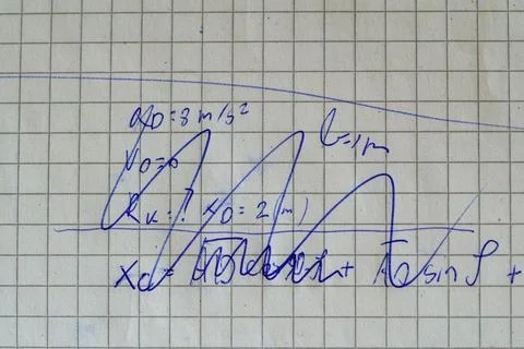 Handwritten kinematics problem with acceleration values Stock Photos