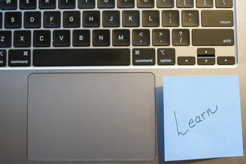 Handwritten Learn Motivation Note on Laptop 写真素材