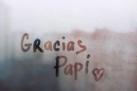 Handwritten lettering text Gracias Papi in spanish is Thanks Daddy in english Stock Photos