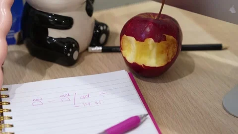 Handwritten Math Formula and Snack on Desk Stock Footage 334743724