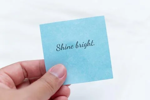 Handwritten note with inspiring text bright background close-up view encouraging Stock Photos