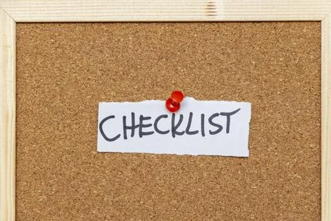 A handwritten note labeled CHECKLIST pinned to a corkboard. This image captures 写真素材