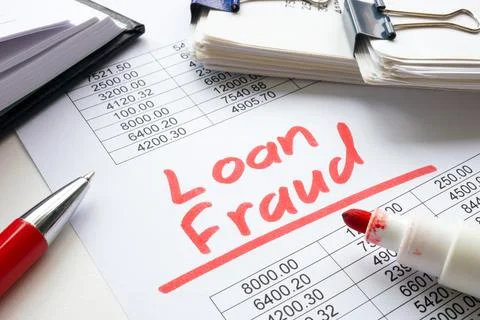 Handwritten note loan fraud on document. Stock Photos