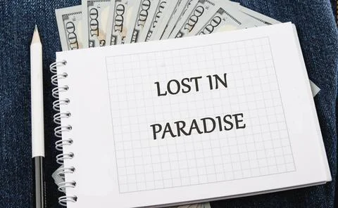 A handwritten note reading lost in paradise is surrounded by fresh hundred Stock-Fotos