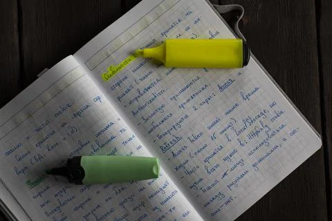 Handwritten Notes and Highlighters on a Grid Notebook Stock Photos