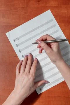 Handwritten notes and a treble clef. A sheet of paper with notes Stock Photos