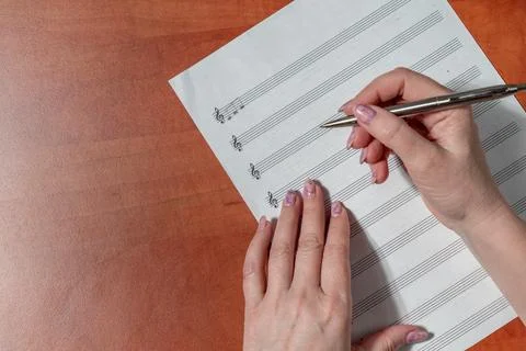Handwritten notes and a treble clef. A sheet of paper with notes Stock Photos