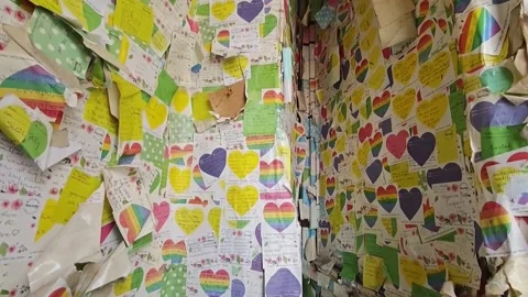 Handwritten notes from around the world cover walls of café in Hanoi, VIETNAM, V Stock Footage 330572148