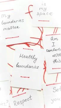 Handwritten notes on boundaries connected with red thread on white background Stock Photos
