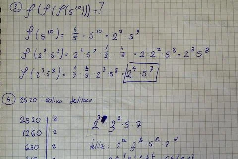 Handwritten number theory problem prime factorization Stock Photos