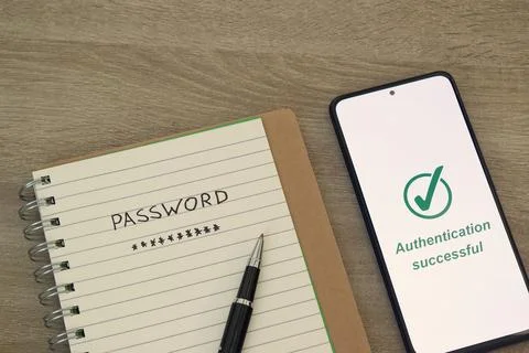 Handwritten Password Note with Pen and Phone Showing Authentication Successfu Stock Photos