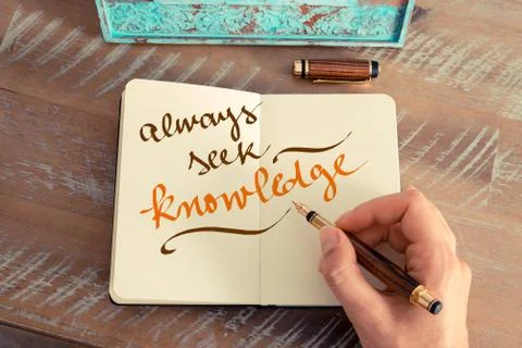 Handwritten text ALWAYS SEEK KNOWLEDGE Stock Photos