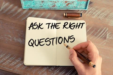 Handwritten text ASK THE RIGHT QUESTIONS Stock Photos