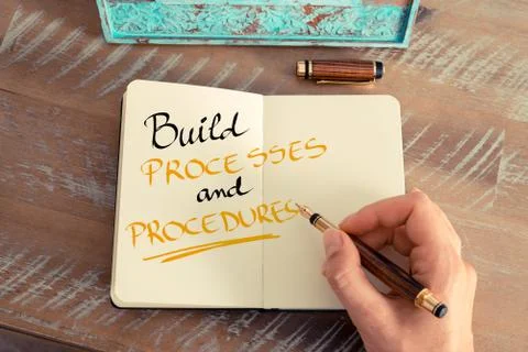 Handwritten text Build Processes and Procedures Stock Photos