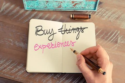 Handwritten text Buy Experiences instead of Things Stock Photos