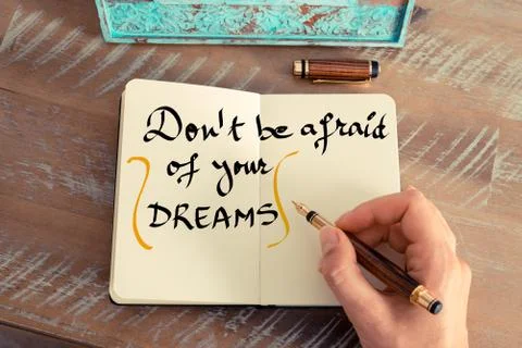 Handwritten text DON'T BE AFRAID OF YOUR DREAMS Stock Photos