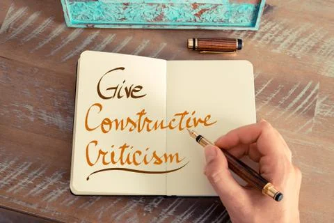 Handwritten text GIVE CONSTRUCTIVE CRITICISM Stock Photos
