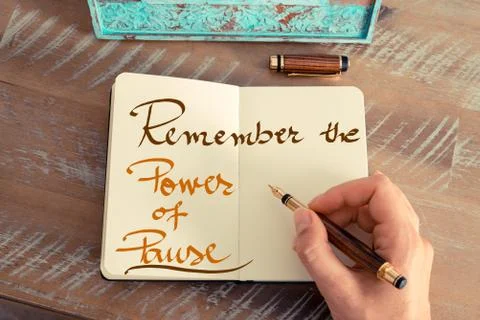 Handwritten text REMEMBER THE POWER OF PAUSE Stock Photos