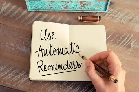 Handwritten text Use Automatic Reminders Stock Photos