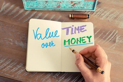 Handwritten text Value Time Over Money Stock Photos