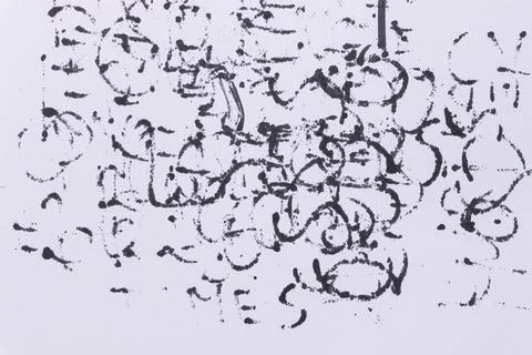 Handwritten text on white paper featuring abstract symbols and patterns. The Stock Photos