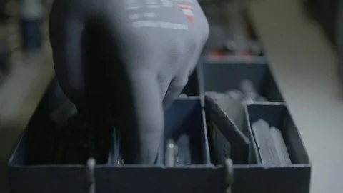 Handy man looking for the right size drill Stock Footage 69772751