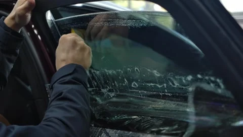 Handy Squeegee Car Glass Window Water And Soap Scraper. Slow Motion Shot Stock Footage 273479360