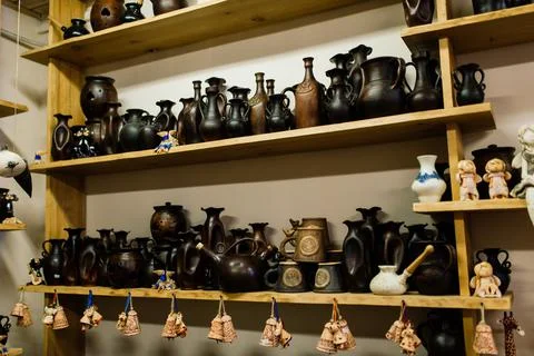 Handycraft clay brown tableware, earthenware jug in pottery workshop. Ceramic Stock Photos