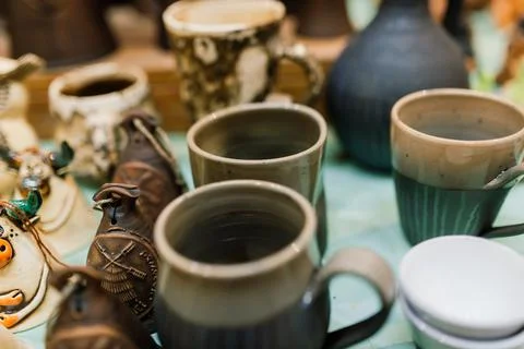 Handycraft clay brown tableware, earthenware jug in pottery workshop. Ceramic Stock Photos