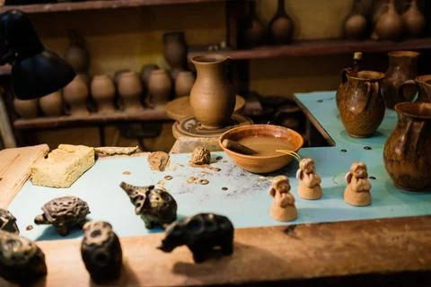 Handycraft clay brown tableware, earthenware jug in pottery workshop. Ceramic Stock Photos