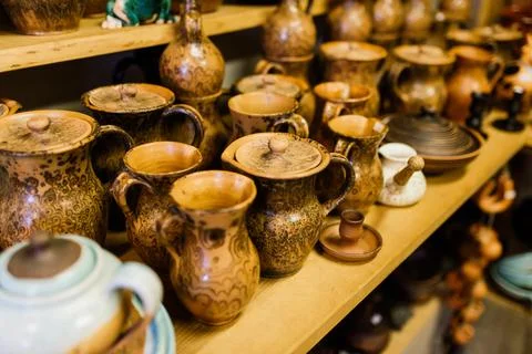 Handycraft clay brown tableware, earthenware jug in pottery workshop. Ceramic Stock Photos