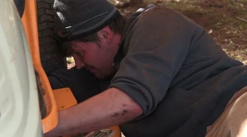 Handyman analyzing issue with tractor Stock Footage 44778345