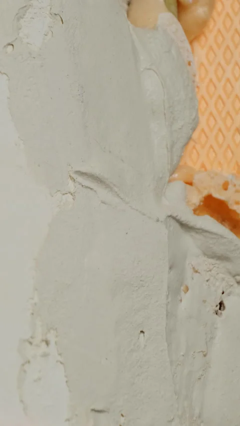 Handyman applies spackling paste to uneven surface of wall Stock Footage 317085045